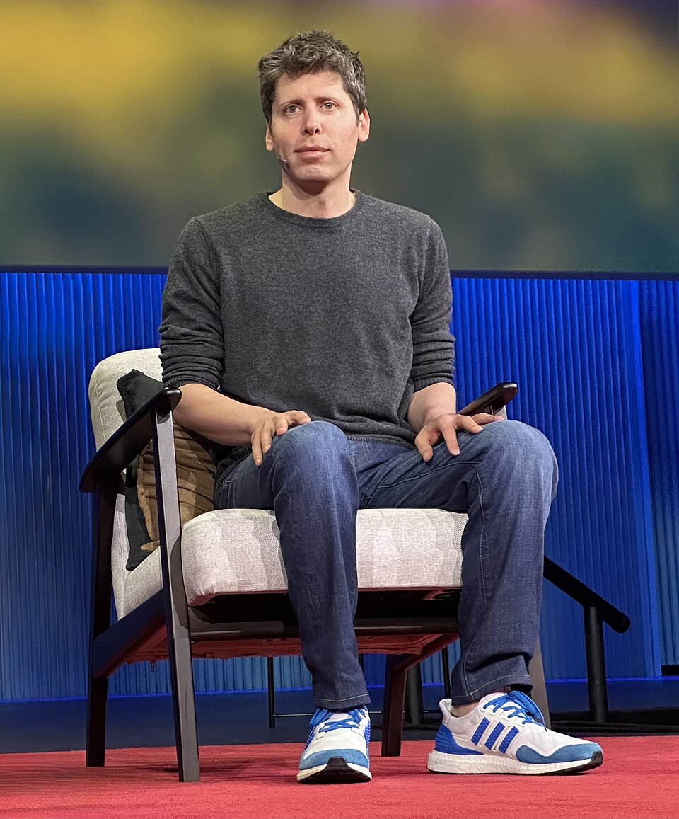 Sam Altman, chief executive of OpenAI, seated on stage at a TED conference