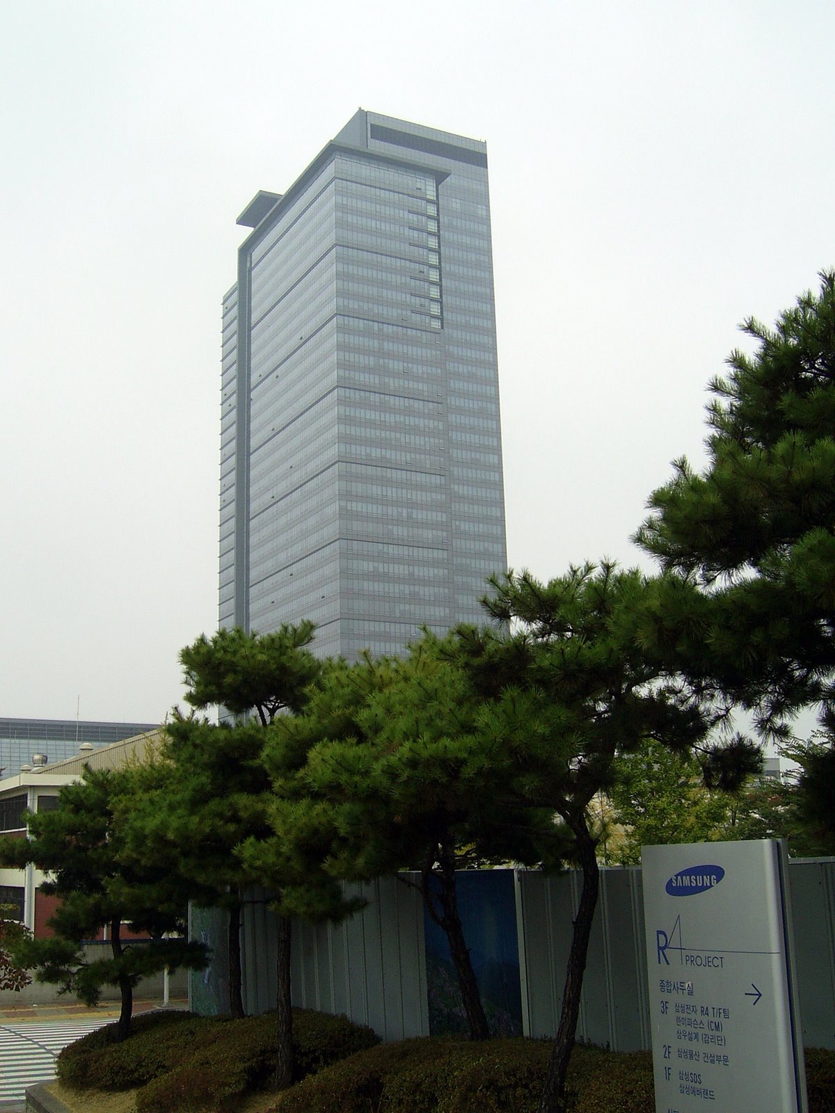 A Samsung office tower at the Samsung Digital Complex in Suwon, South Korea, with Samsung signage in the foreground