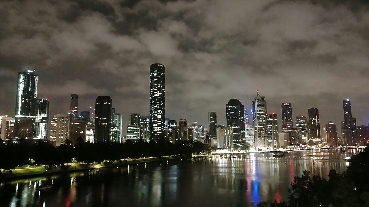 The Brisbane city skyline at night, viewed across the Brisbane River