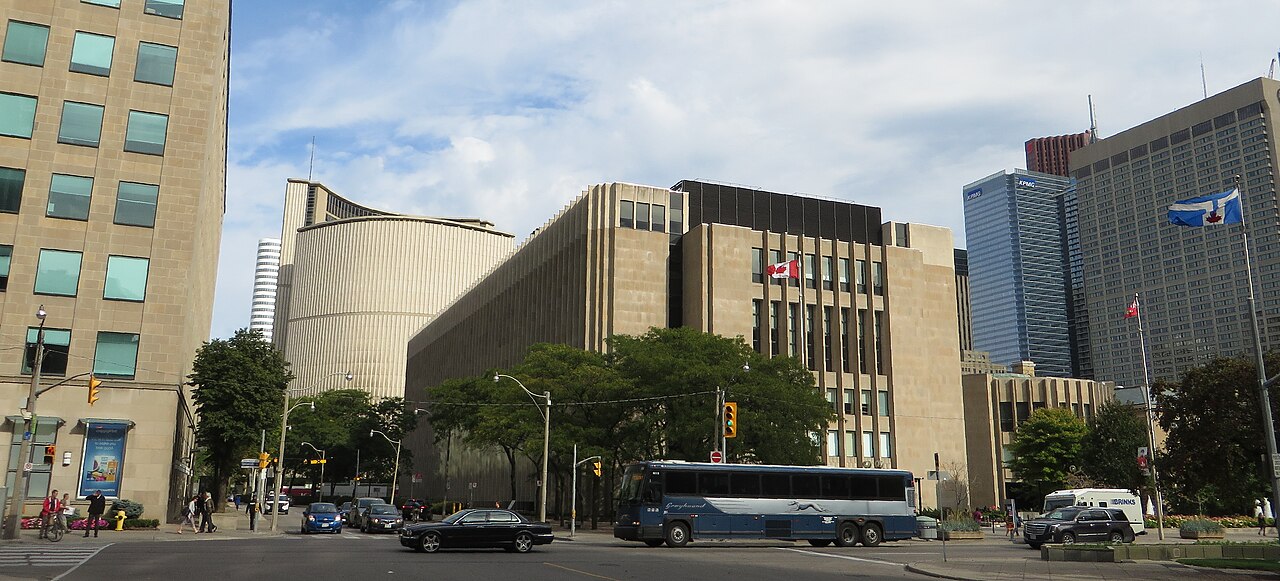 The Ontario Superior Court of Justice courthouse building beside Toronto City Hall seen from a downtown intersection