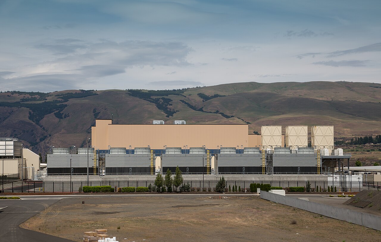A large data center facility with rows of cooling towers
