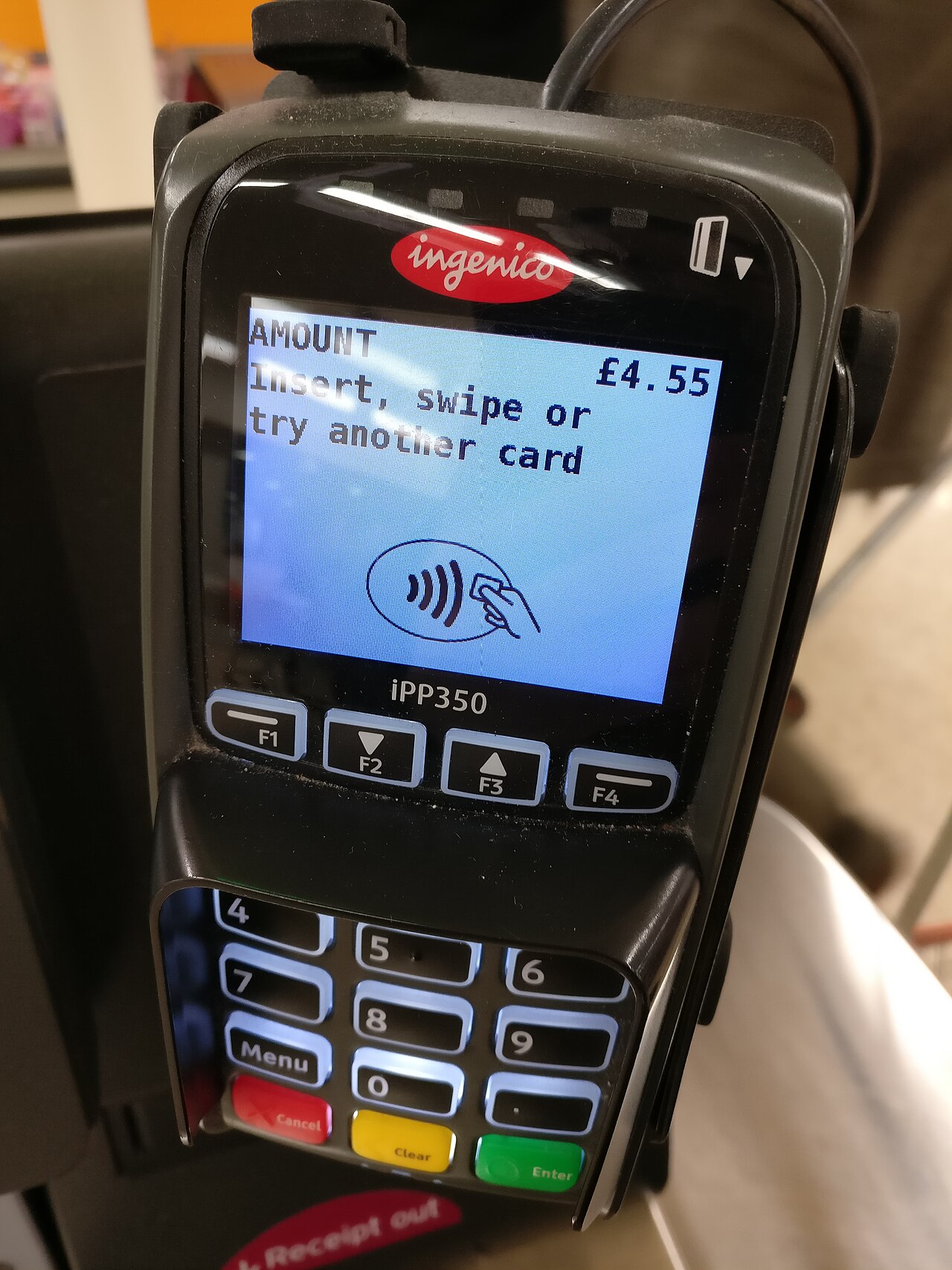 Ingenico iPP350 card payment terminal showing an amount of 4.55 pounds and a contactless symbol