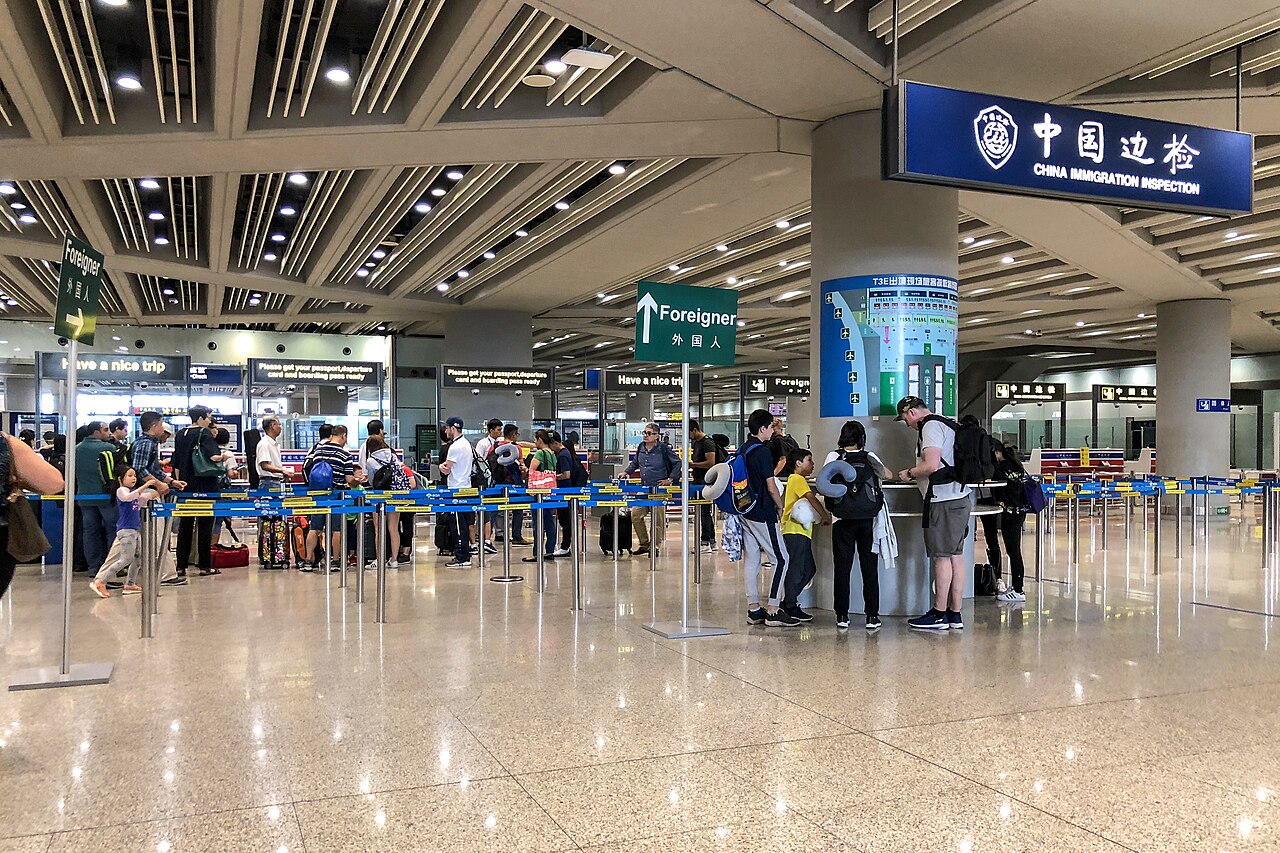 Passengers queueing at the China Immigration Inspection area for foreign passport holders at Beijing Capital International Airport Terminal 3E