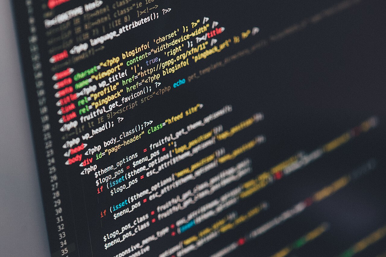 Close-up photograph of colorful source code displayed on a computer monitor