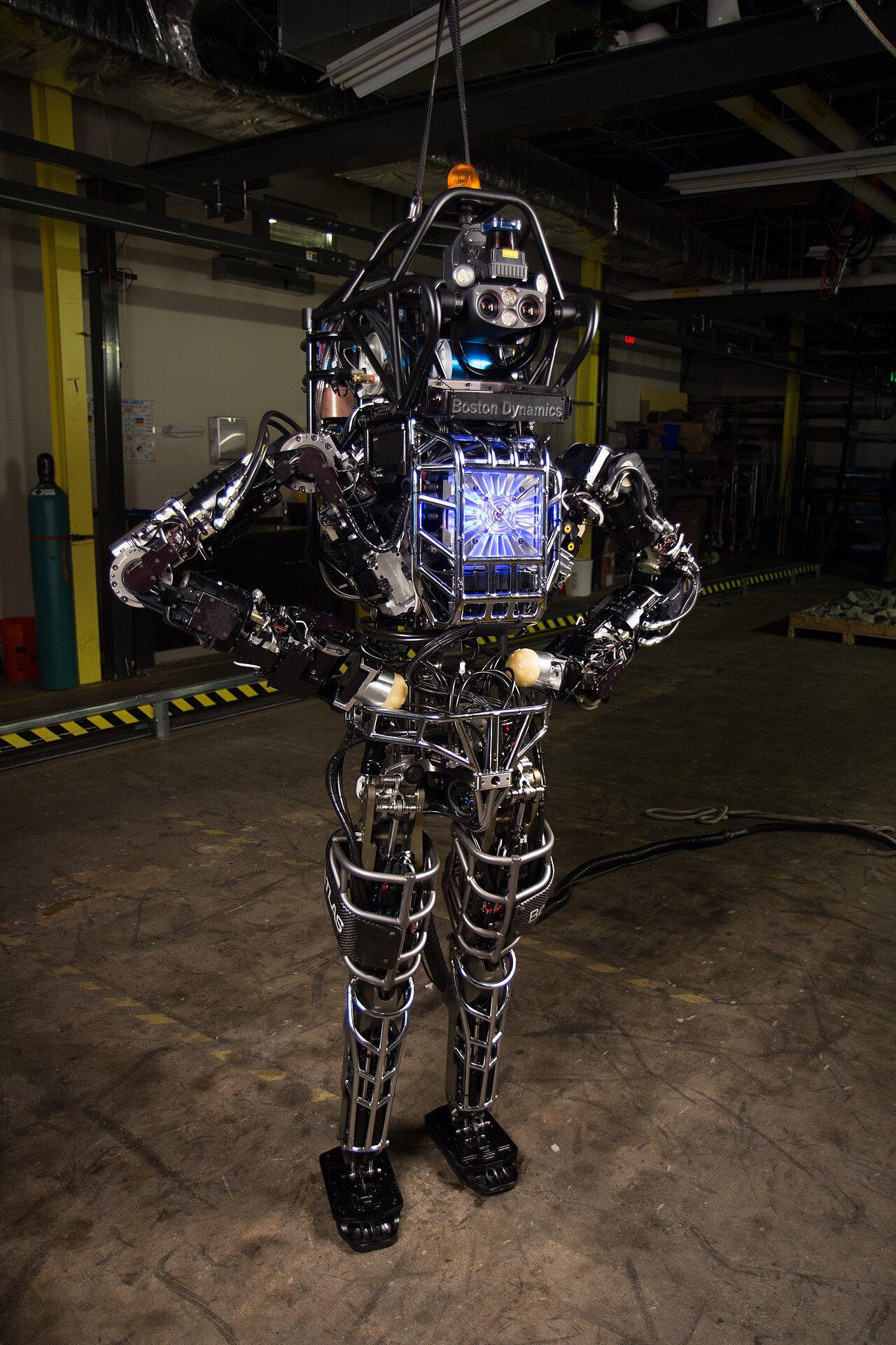 A Boston Dynamics Atlas humanoid robot standing in a laboratory during testing