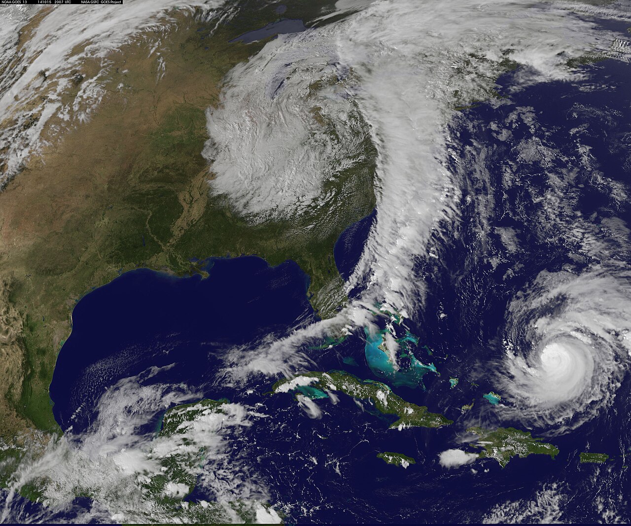 A NASA GOES satellite image showing a hurricane and weather systems over North America and the Atlantic