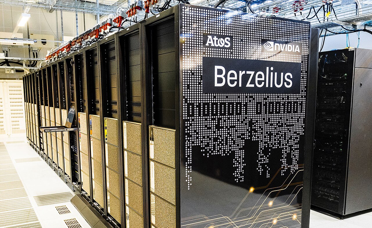 Rows of GPU server racks in an AI supercomputer, with an Atos and NVIDIA branded nameplate reading Berzelius