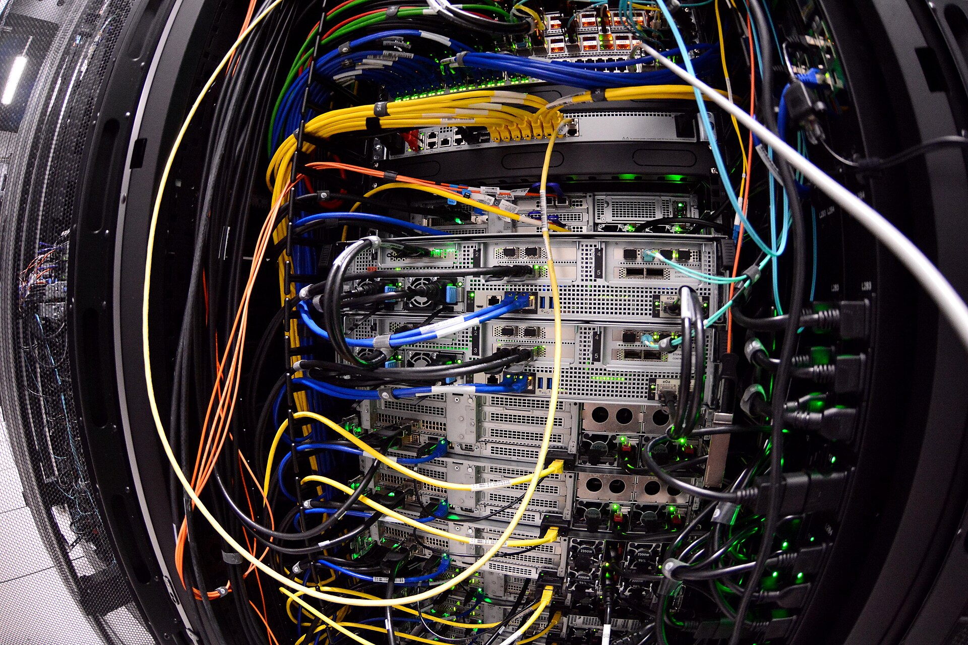 Dense server cabling and rack-mounted compute nodes inside an AI and high-performance computing data center