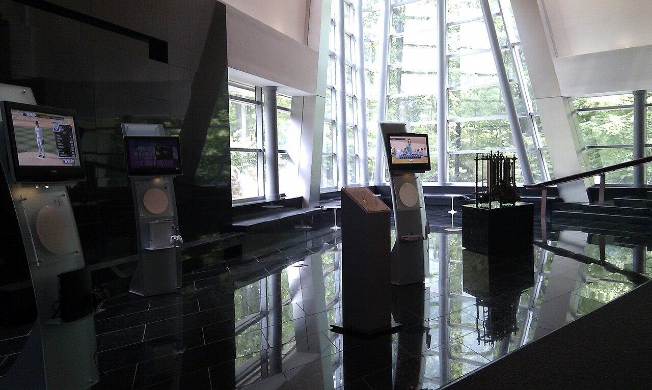 The glass-walled lobby of IBM's corporate headquarters in Armonk, New York, with interactive display kiosks