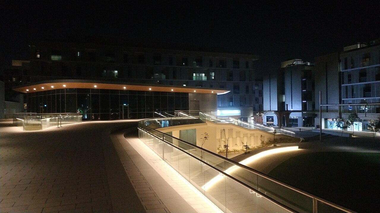 Buildings and walkways in Masdar City, Abu Dhabi, photographed at night