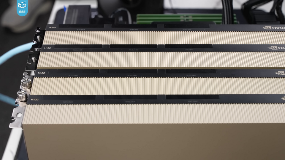 Four Nvidia H100 data centre accelerator cards installed side by side in a server chassis