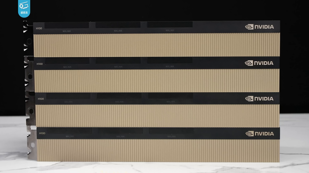 Four NVIDIA H100 data-center accelerator cards stacked, showing their NVLink connectors
