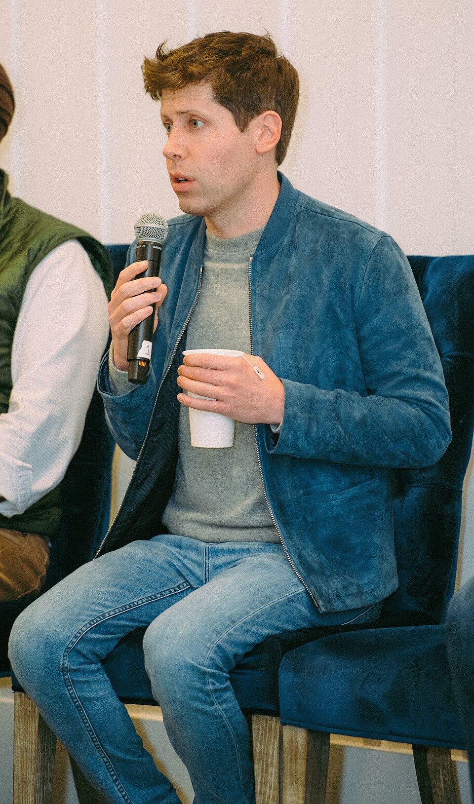 Sam Altman, CEO of OpenAI, speaking while seated with a microphone