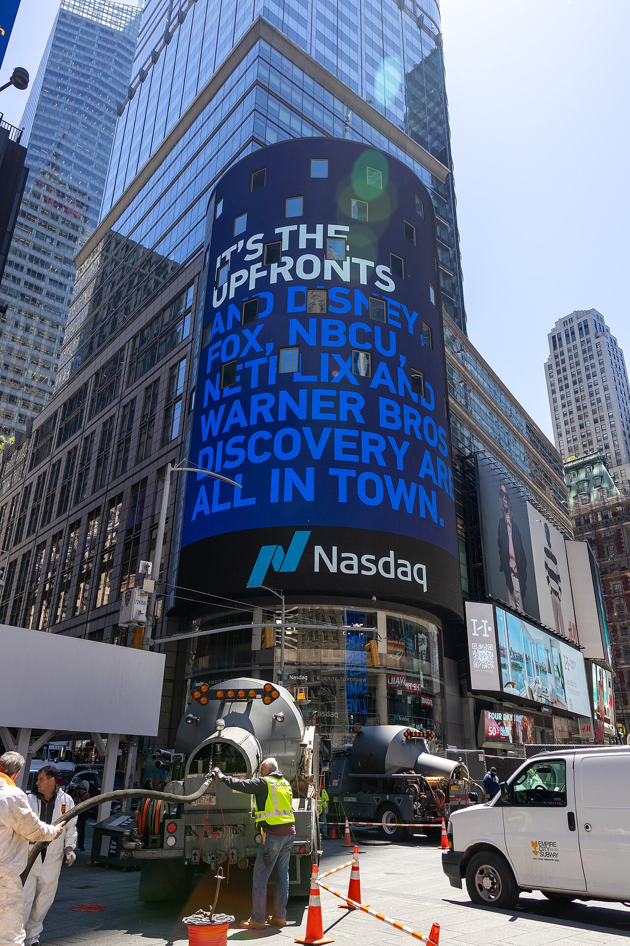 The curved LED display of the Nasdaq Tower in Times Square, New York, photographed from street level