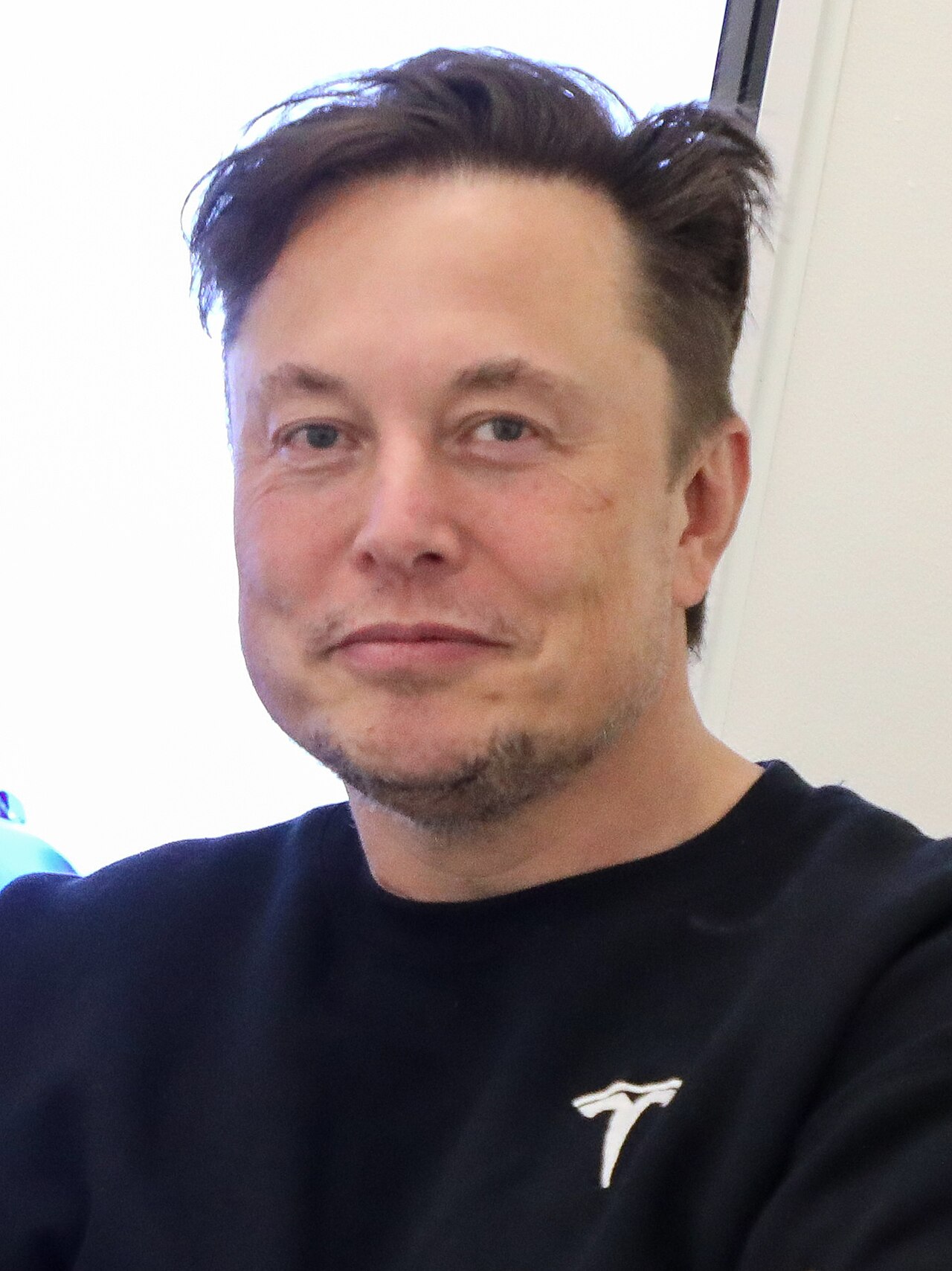 Portrait of Elon Musk, whose SpaceX now owns both xAI and Cursor