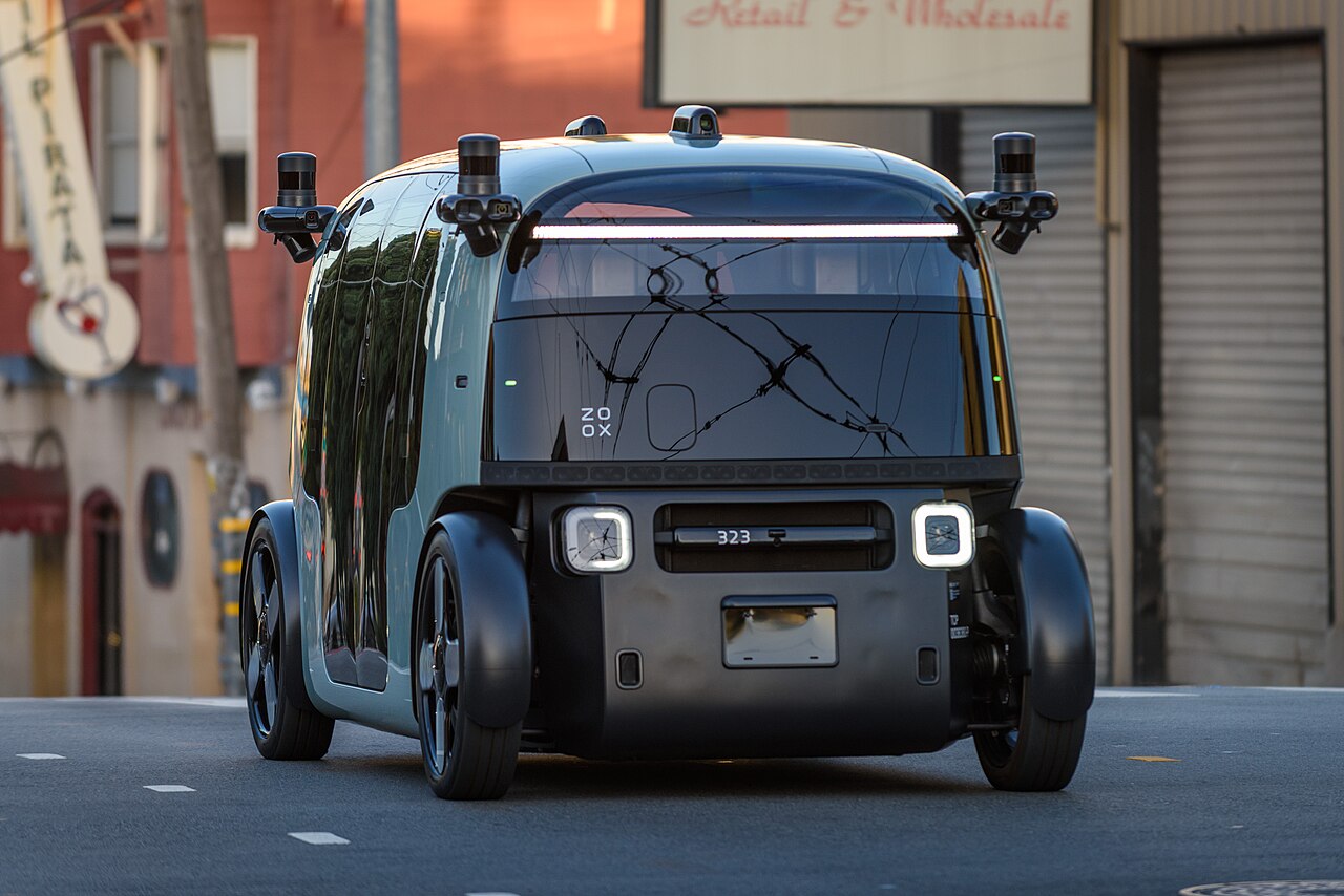 A driverless autonomous robotaxi on a city street, illustrating the vehicle category
