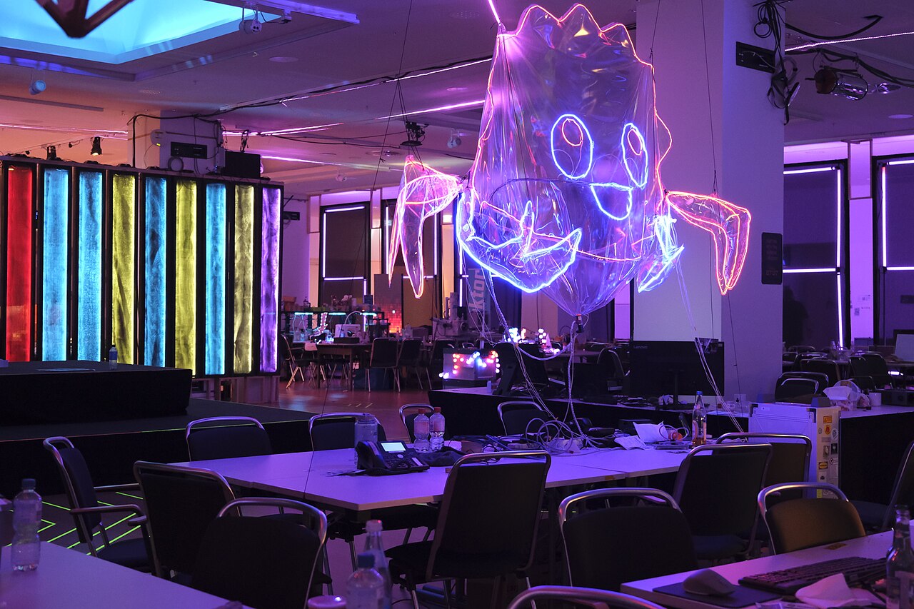 A large illuminated inflatable of Ferris, the Rust mascot, at the Rust assembly during a Chaos Communication Congress
