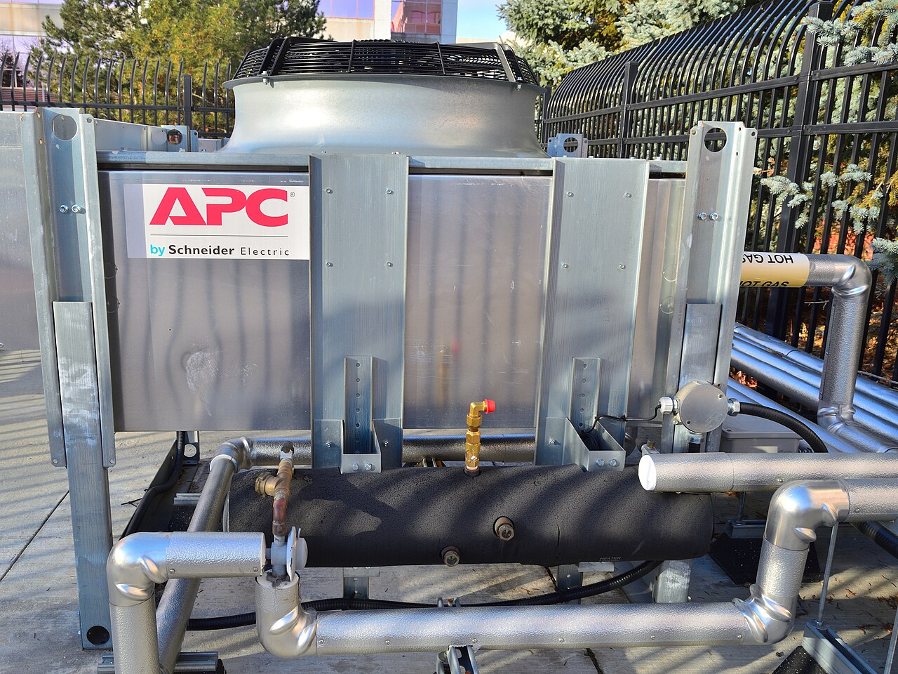 An outdoor APC by Schneider Electric data center cooling unit with insulated pipework