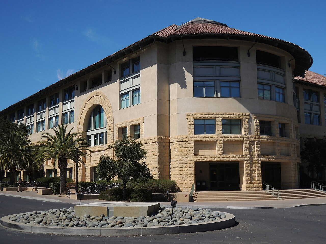 Exterior view of the Gates Computer Science Building on the Stanford University campus, showing its Computer Science building signage