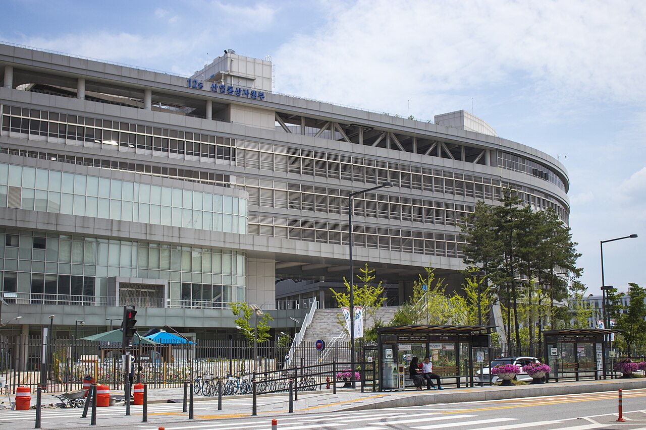 A ministry building in Government Complex Sejong, South Korea, with a sign reading Ministry of Trade, Industry and Energy