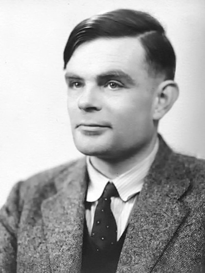 Black and white studio portrait of the mathematician Alan Turing, photographed in 1951