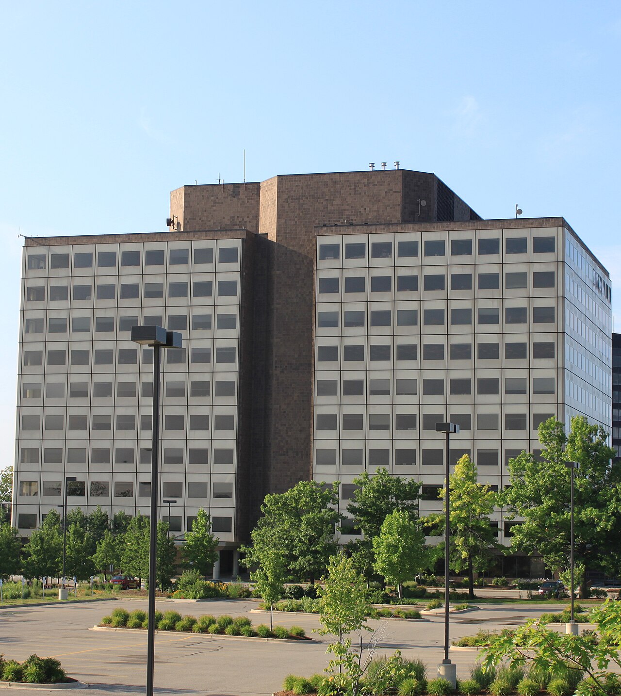 The Thomson Reuters 777 Building, a large office building in Ann Arbor, Michigan, surrounded by trees