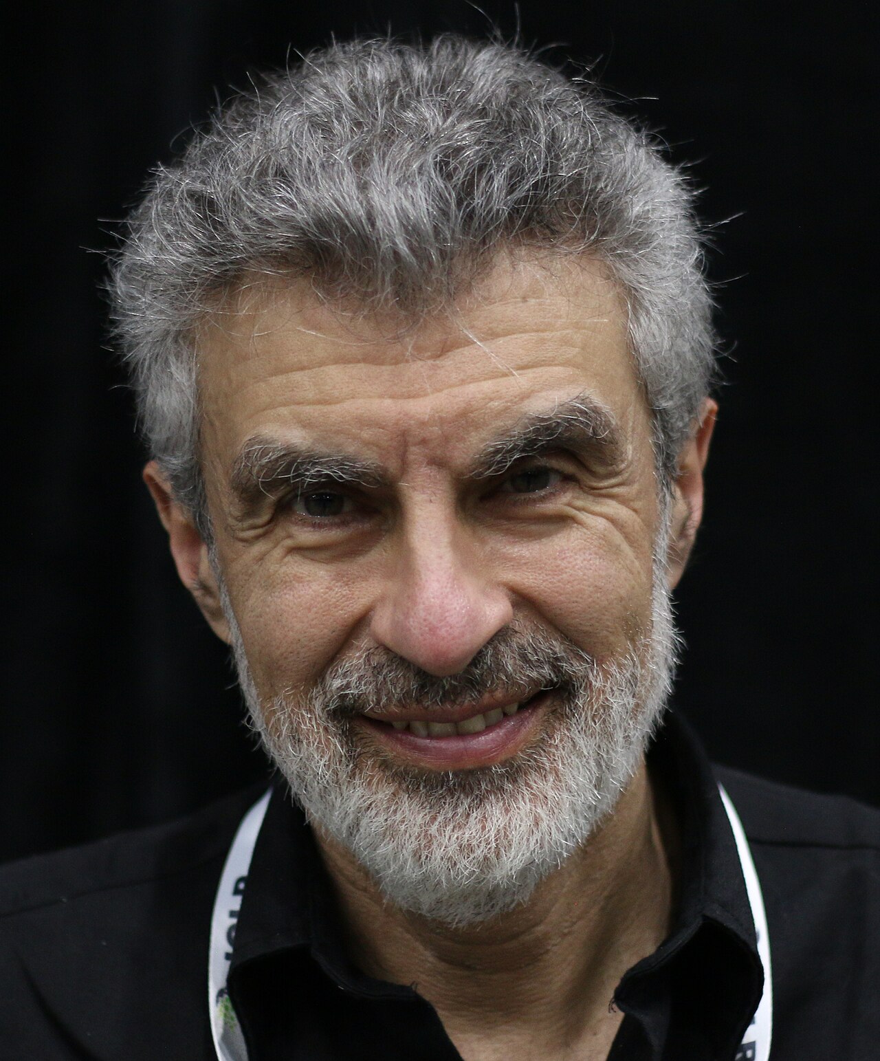 Portrait of Yoshua Bengio, co-chair of the UN Independent International Scientific Panel on AI, photographed at a machine learning conference in 2025