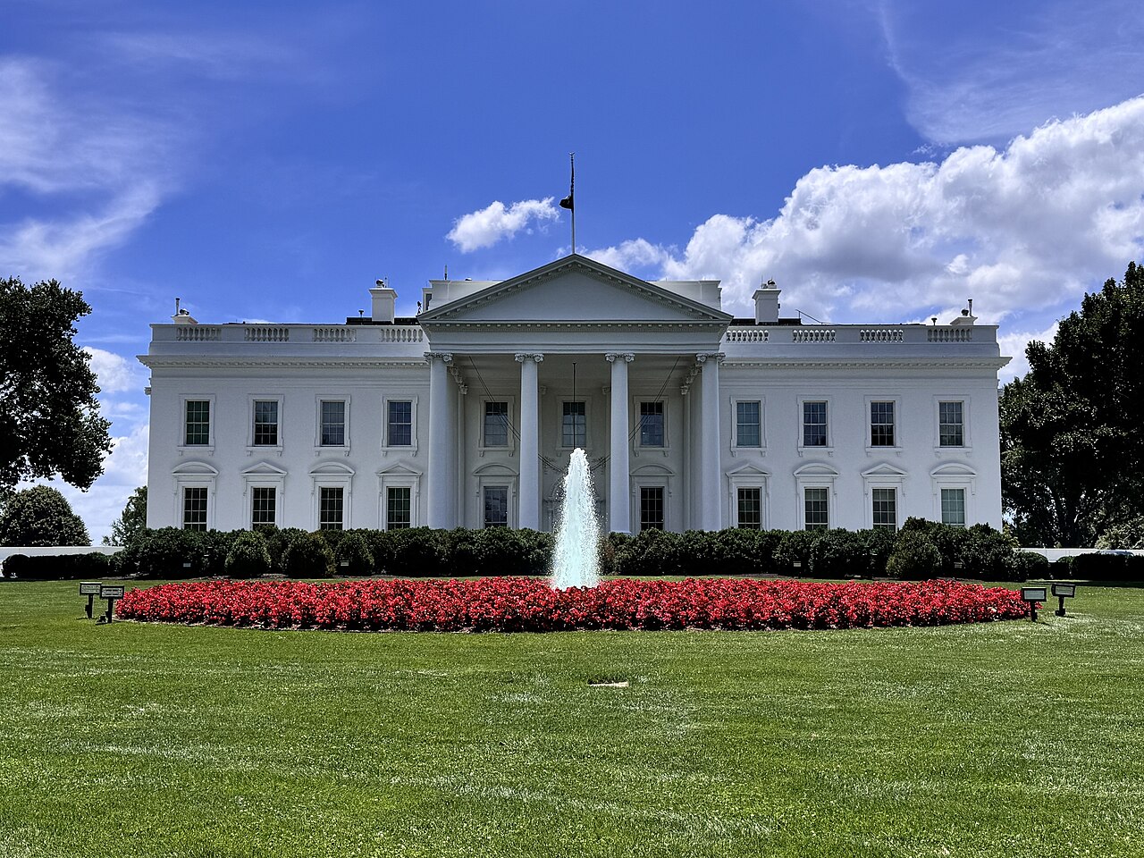 The north facade of the White House in Washington, D.C. under a blue sky