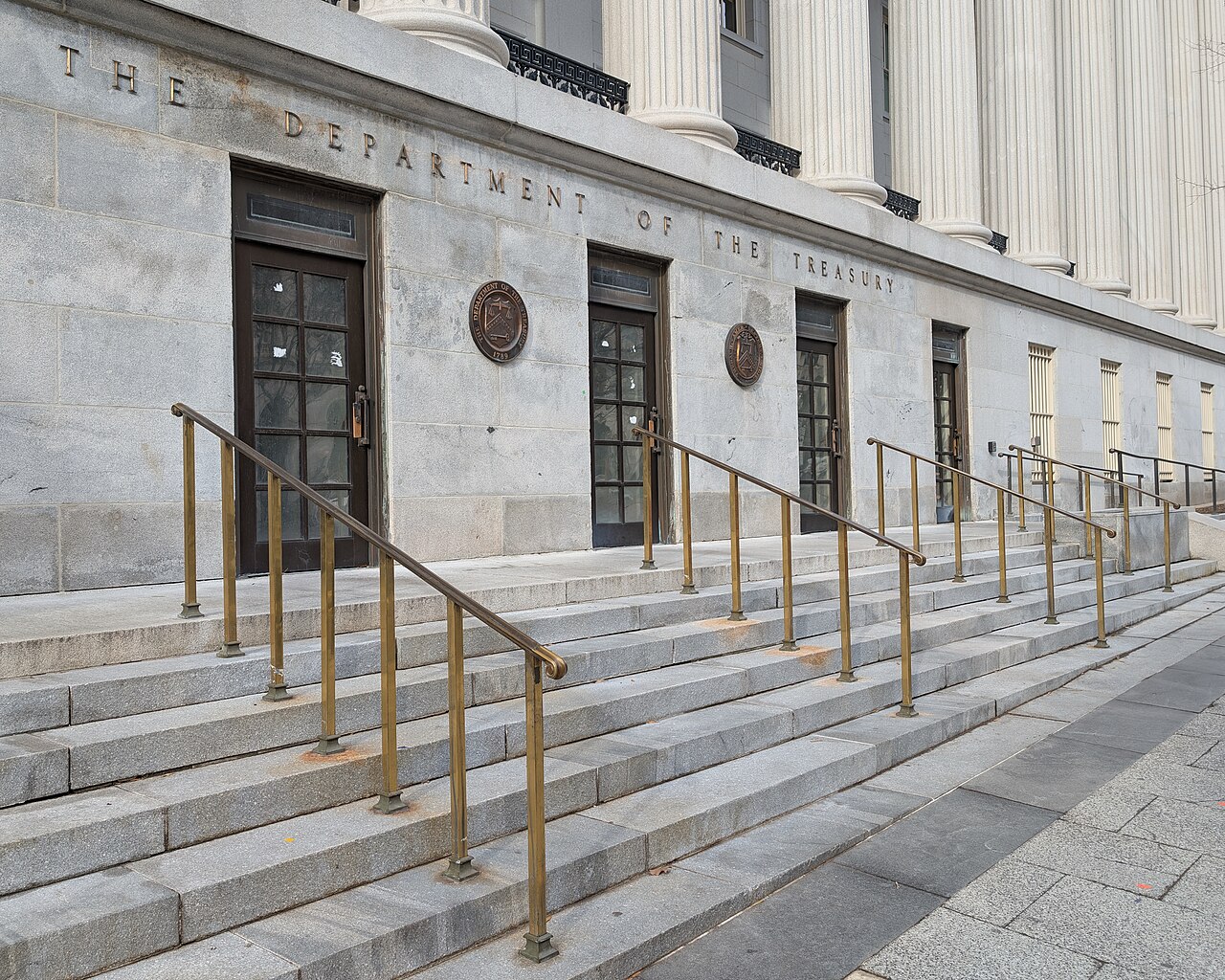 The engraved entrance sign reading 'The Department of the Treasury' on the Treasury Building in Washington, D.C.